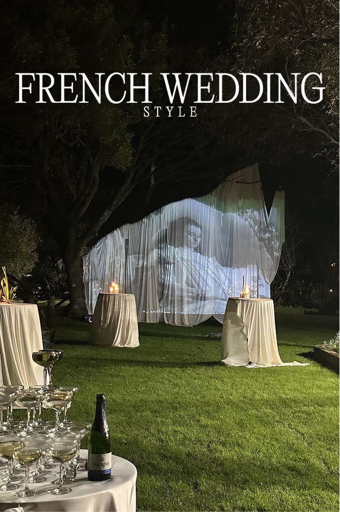 French Wedding Style cover: a film projected onto sheer drapes strung between trees at night
